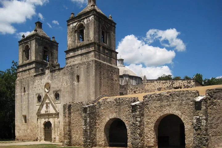 Mission Concepcion stone church with twin bell towers and arches